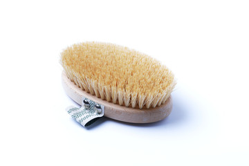 Natural wooden brush on a white background