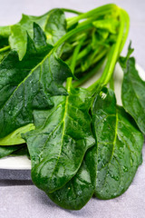 Young fresh leaves of green organic spinach ready to cook
