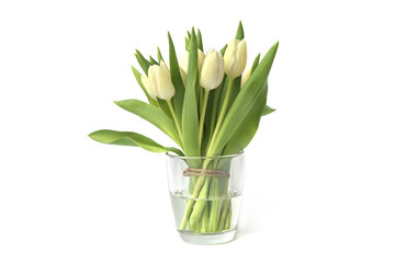 White tulips bouquet in glass vase isolated on white background. Spring bouquet of fresh tulip flowers..