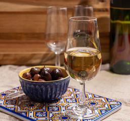 Fortified wine from Andalusia, Spain, different types of sherry in glasses and olives, colors of Andalusisa