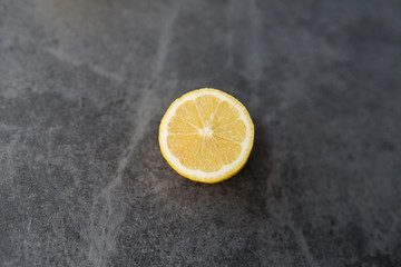 yellow lemon cutaway on a gray background