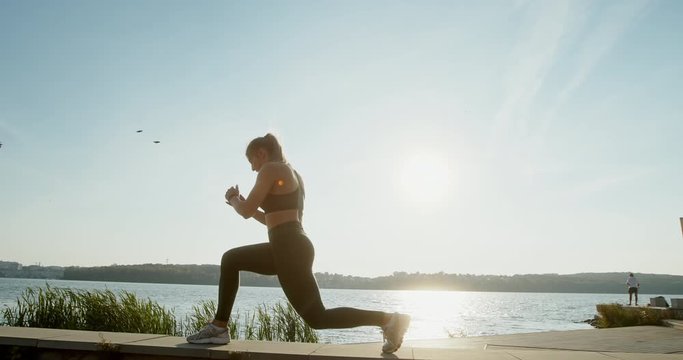 Female athlete doing walking lunges