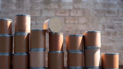 Close up stack of the old brown paper buckets [paper tank] for reuse and recycle with concrete wall...