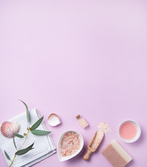 Obraz na płótnie Canvas natural organic cosmetics with pink Himalayan salt, soap and eucalyptus branch on a pink background
