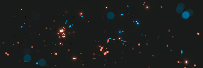blurred blue and orange sparks from neon lights in front of black backgound