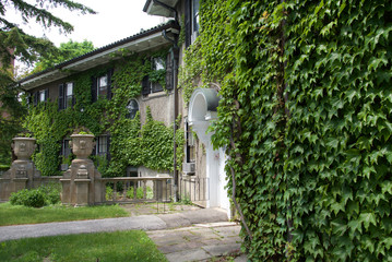 Toronto, Ontario / Canada - May 29 2016 : Gothic style building with landcape garden