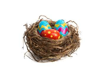 Fototapeta premium nest with chocolate eggs isolated