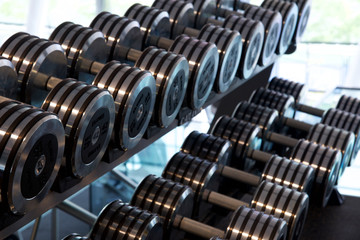 Fototapeta na wymiar Toronto, Ontario / Canada - May 24 2015 : Dumbbell in exercise gyms Studio