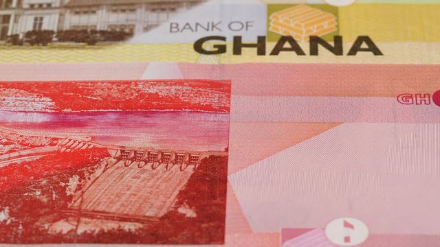 Ghana cedi banknotes slow tracking. Ghanaian currency. Slider shot, low angle. 4K