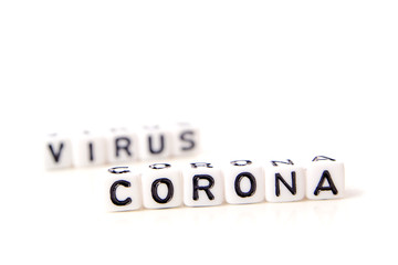 the title made of miniature white dices with black letters of very dangerous deadly corona virus type on white background