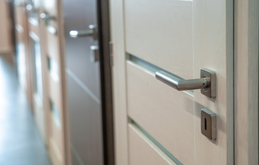 samples of doors of different colors and design in the furniture store.