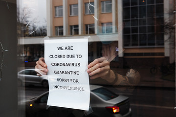 Biohazard concept of living in a new reality of coronavirus epidemy hysteria café owner sticks...