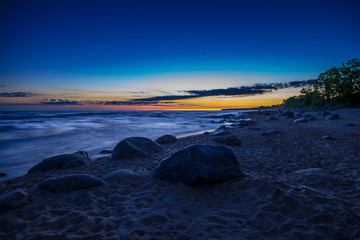 sunset on coast of sea