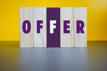 OFFER, Wood Blocks on Yellow Background.