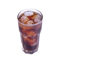 A cola glass with ice on white isolated background and copy space 