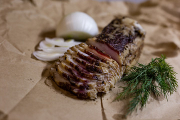 Still life of appetizing bacon with greens