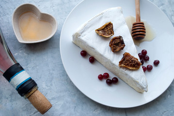 Brie cheese. Food for wine and romantic, cheese delicacies. Horizontal menu design. 