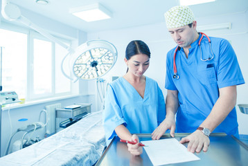 Man surgeon at work in operating room