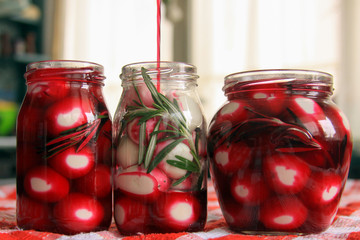 Marinated quail eggs in jars