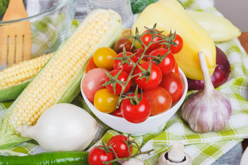 Still life from colored vegetables and mushrooms, blurred background