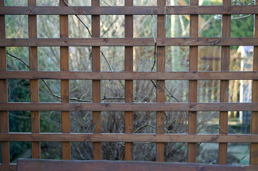openwork wall of garden gazebo made of wooden slats