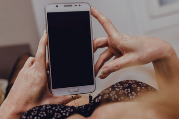 closeup of woman's hand with mobile phone