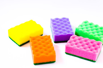 multi-colored sponges on a white background, isolate.