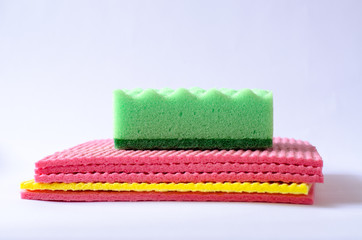 multi-colored sponges on a white background, isolate.