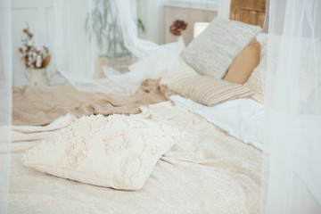 Beautifully decorated farmhouse look. cozy textiles blankets on the bed and pillows as an element...