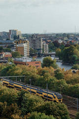 Dutch yellow NS train - Sprinter - Intercity Direct - with Leiden view