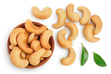 Roasted Cashew nuts in wooden bowl isolated on white background with clipping path and full depth of field. Top view. Flat lay