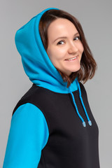 Woman in black and blue hoodie, mockup for logo or branding design