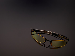 Computer game protective UV glasses on a gray gradient background