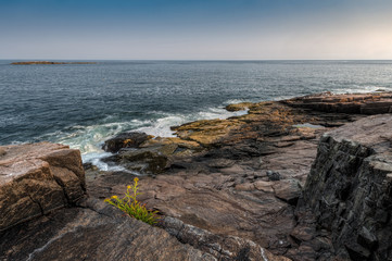 Fototapeta na wymiar Waves at Edge of Maine Shoreline