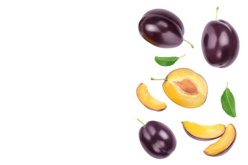 fresh purple plum and half with leaves isolated on white background with clipping path and copy spase for your text. Top view. Flat lay