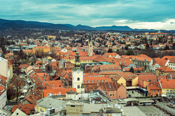 Fototapeta na wymiar Zagreb city skyline with Church Of St. Mary and residential buildings rooftops, Croatia.