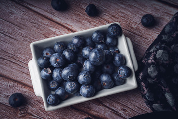 Still life of blueberries. Dark food. Sweet dessert.