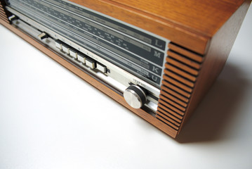 Old vintage radio in wooden case, retro style. Close up.