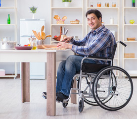 Young disabled husband preparing food salad