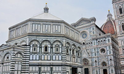 Fototapeta na wymiar Baptistery of Saint John, Baptistery di San Giovanni and front facade of Basilica di Santa Maria del Fiore on Piazza del Duomo