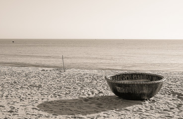 Traditional round basket boats made from bamboo, on the beach and other coastal regions of center...