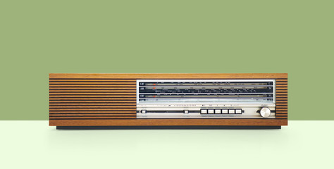 Old vintage radio In wooden case, retro style.