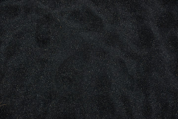 Black sand floor texture from above. Background. - Powered by Adobe