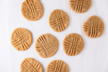 Top view of peanut butter cookies isolated on parchment paper