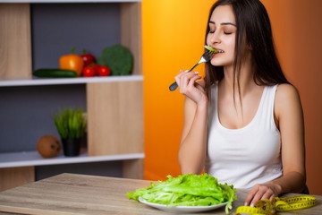 Portrait of young beautiful girl adhering to diet regime