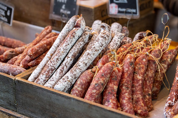 Gourmet artisan chorizo sausages on display on a market stall