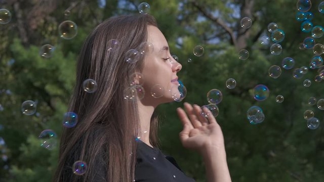 Teen in soap bubbles.