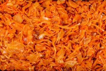 Stewed cabbage with carrots, onions and tomato sauce. Texture