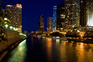 Fototapeta na wymiar Nighttime reflections of the Chicago city skyline in the Chicago River.