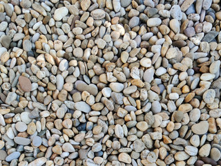 crushed stone on the seashore, Pebble stones background, gravel texture for 3d, photo